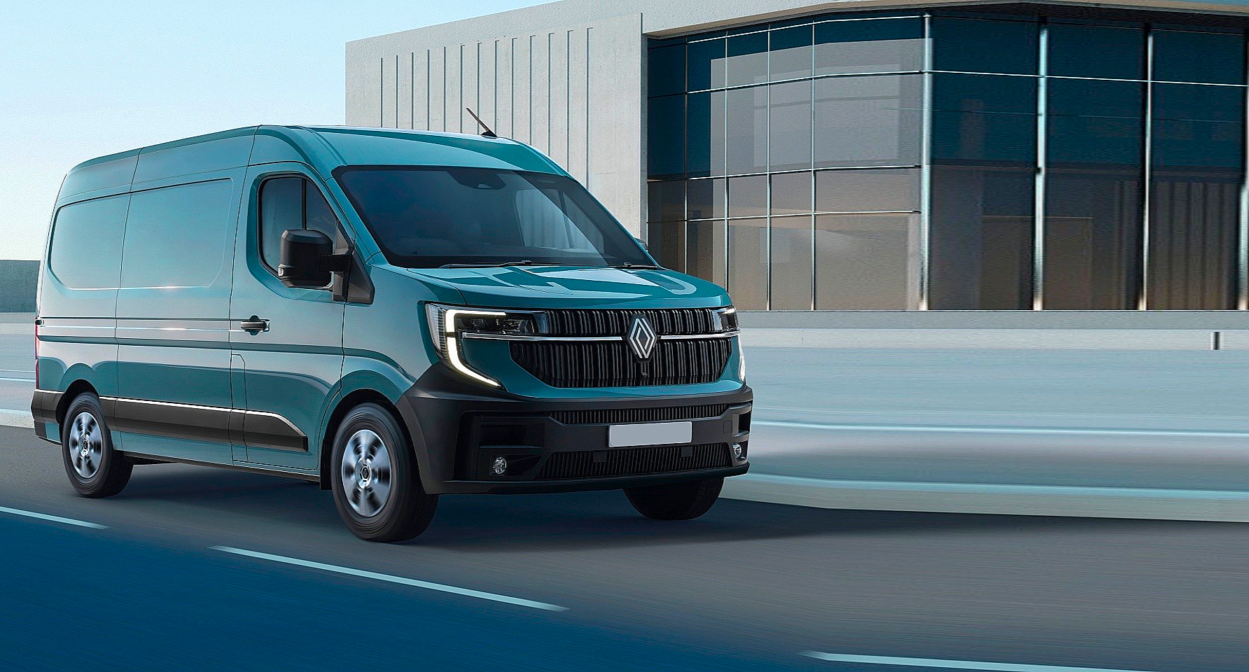 Silver van driving on a city street